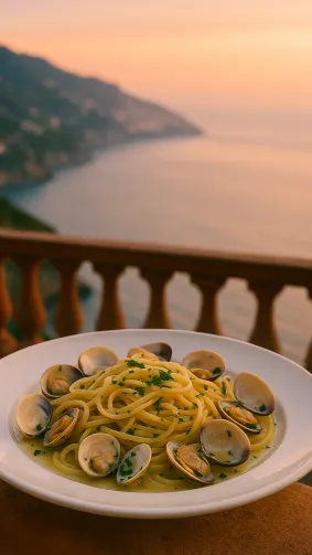Linguine alle vongole with fresh clams, parsley, and white‑wine sauce, captured on a seaside terrace overlooking the Amalfi coast at sunset — warm pastel sky, soft sea‑spray haze, 35 mm lens bokeh.